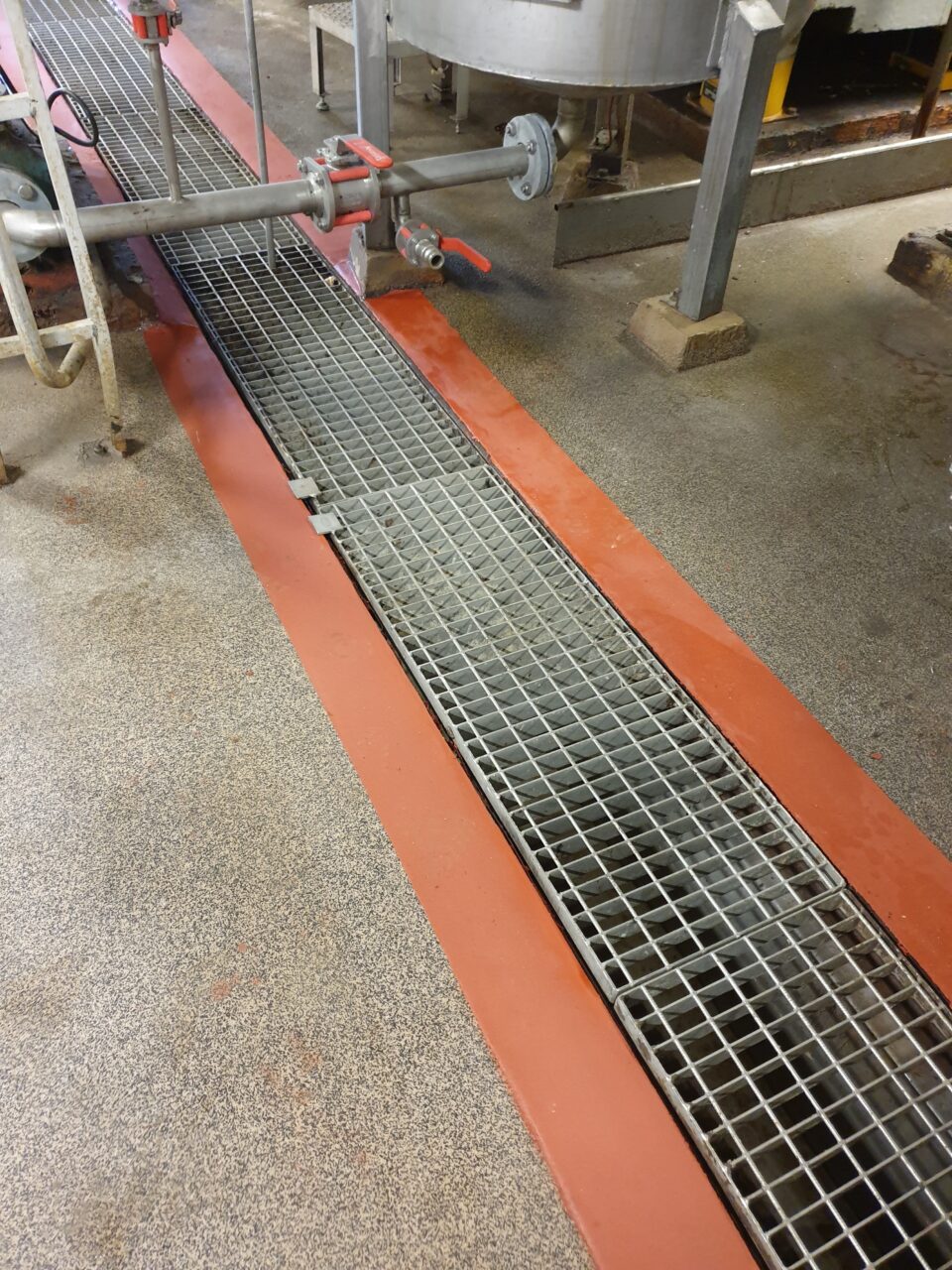 Drain channel protected with chemical resistant coating