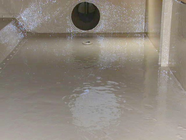 A containment area specifically, a storage tank after being coated with Belzona 5811