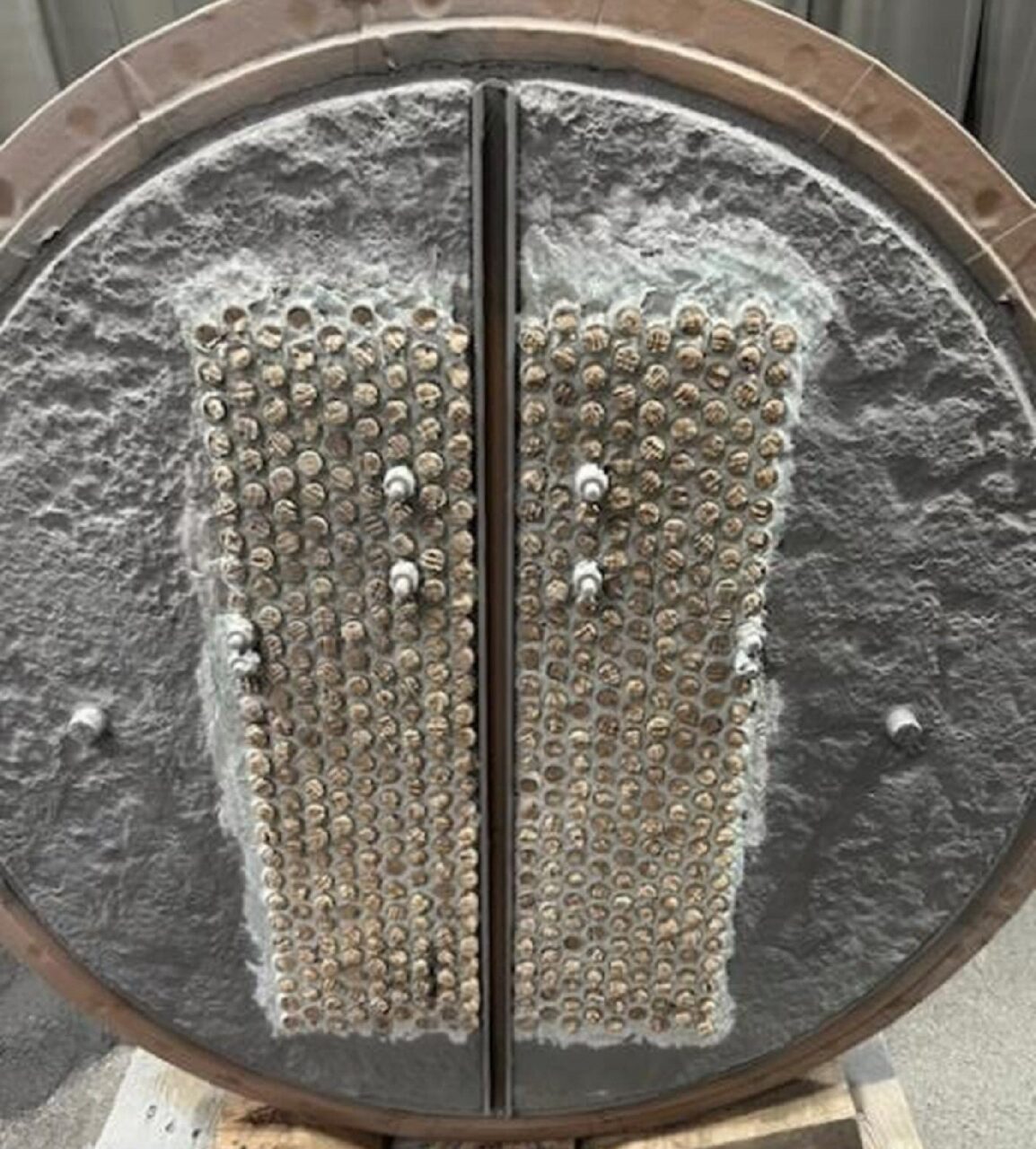 Pitted and cracked heat exchanger rebuilt and protected with Belzona