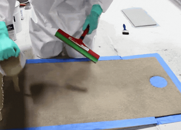 Pour the fully mixed material onto the target concrete surface