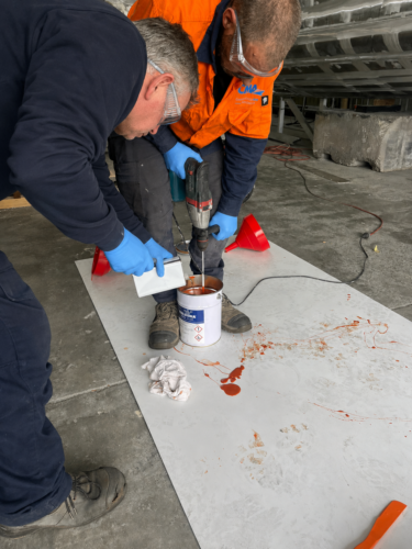 Mixing the liquid shimming epoxy, Belzona 7111