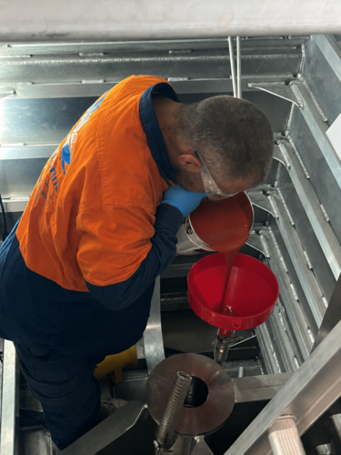 Pouring the shimming material into the bearing housing