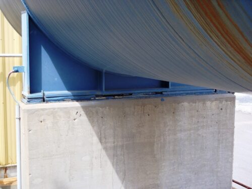 Failed existing grout between tank base and concrete base