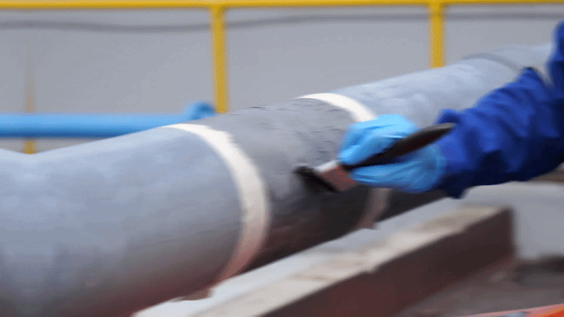 Corroded pipe rebuilt with epoxy repair composite