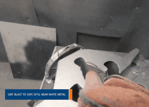 Roughen surfaces to achieve the requirements of SSPC-SP10, near white metal with a minimum depth profile of 75 microns