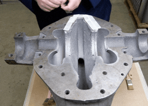 Apply masking tape to define the repair area on the pump