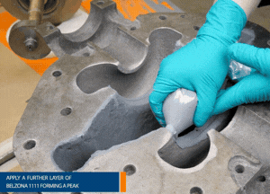 Use a piping bag to apply Belzona 1111 (Super Metal), building the peak on the ring seat