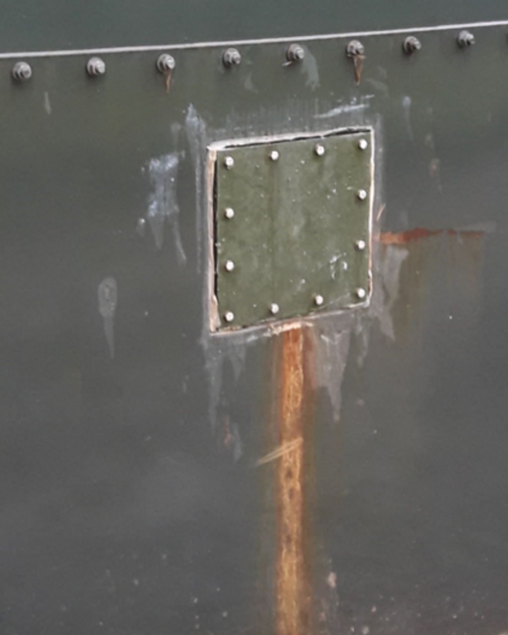 Belzona cold-bonding adhesive was applied to the riveted area with additional topcoat for further edge protection and corrosion protection, providing long-term repair solution without welding or riveting
