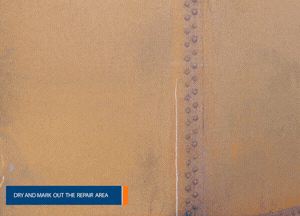 Identify the repair area on the storage tank and ensure the target area is dry