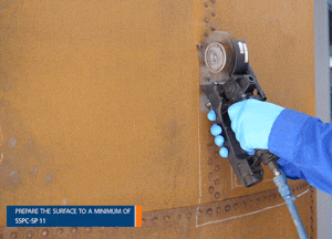 Clean the exterior tank substrate to achieve an SSPC-SP 11 bare metal standard with a minimum profile of 25 µm (1 mil)