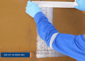 Mark out the repair area on the riveted tank exterior to ensure a clean finish
